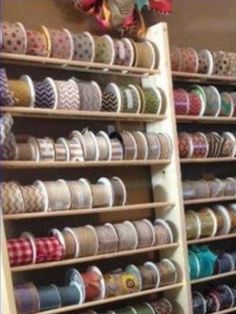 the shelves are filled with different types of ribbons