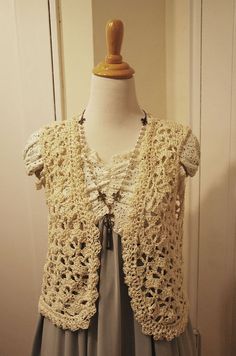 A lovely crochet lacey vest fit for a walk in the forest or quite reading in the park.  Made with cotton yarn so it's suitable for warmer weather and anyone who is allergic to wool.  Flat Measurements: Width: 20.5" Length: 19" Shoulder width: 17" Note:  Mannequin has 33" bust Lace Vest Outfit, Reading In The Park, Crochet Lace Vest, Walk In The Forest, Vest Outfit, Lace Vest, Vintage Vest, Vest Outfits, Crochet Ideas