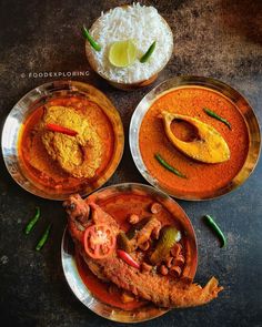 three plates filled with different types of food on top of a table next to rice