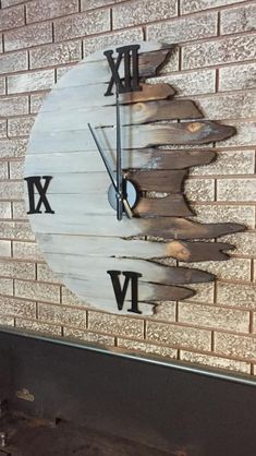 a clock that is on the side of a brick wall