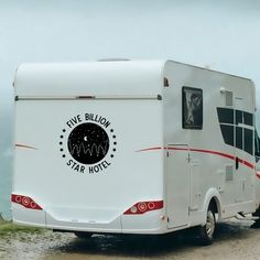 a white rv parked on the side of a road