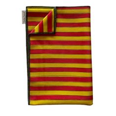 a red and yellow striped pocket square on a white background