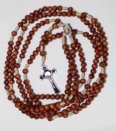 "20 Decade Brown Wood Beads Rosary on Strong Cord Holy Rosary of Sacred Mysteries 46.45, catholic rosary, rosary beads, handmade rosary, 20 Decade Brown Wood Beads Rosary on Strong Cord Holy Rosary of Sacred Mysteries This is a full rosary which includes all 20 decades. Its made of a blue wood beads. The beads are strung on a strong cord for durability. The center is made of metal medal. The centerpiece is double sided. On one side there is Miraculous Jesus and on the other Virgin Mary. The rosa Brown Beaded Cross Rosary, Brown Beaded Spiritual Rosary, Brown Beaded Cross-shaped Rosary, Brown Beaded Rosary With Cross Shape, Brown Rosary With 8mm Beads, Handmade Brown Crucifix Rosary, Brown Rosary With 8mm Beads And Cross Shape, The Mysteries Of The Rosary, Rosary Mysteries