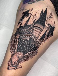 a harry potter tattoo with hogwart's castle in the background and an owl