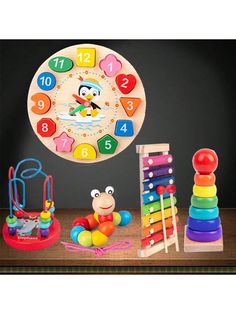 a child's wooden clock and toys on a table with a black wall in the background