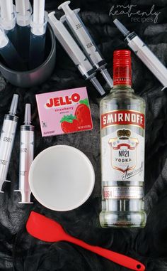 an assortment of medical supplies and utensils laid out on a black cloth