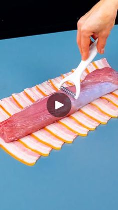 a person is cutting meat with a knife