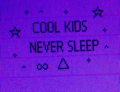 the words cool kids never sleep are displayed on a screen