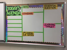 a bulletin board with notes and stickers on it in a school classroom setting that says today's agenda