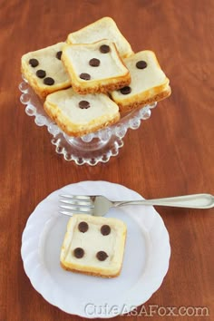 four pieces of cake sitting on top of a white plate