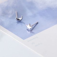 Illuminate your style with our Sterling Silver Asymmetric Star and Crescent Moon Stud Earrings. Handcrafted with precision, these earrings boast an elegant asymmetrical design inspired by the night sky. Delicate stars and crescent moons, each adorned with intricate detailing, create a captivating contrast. Versatile and chic, they add a touch of celestial charm to any outfit. Stud earrings with push back Material: .925 Sterling Silver FREE SHIPPING on all orders Earrings Moon, Moon And Star Earrings, Crescent Moon Earrings, Moon Studs, Tiny Studs, Tiny Earrings, Star Earrings Stud, Tiny Stud Earrings, Star Moon