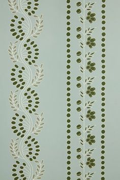 the wallpaper is decorated with green leaves and vines