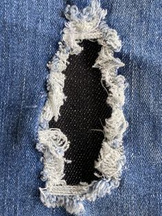 an old pair of jeans with holes in it