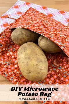 two potatoes sitting in a bag on top of a wooden table