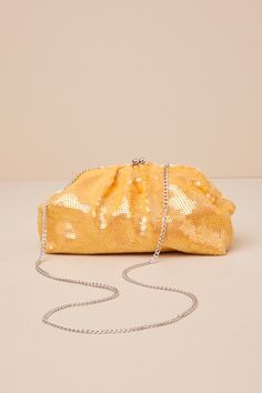 The Lulus Forever Sparkly Golden Yellow Sequin Clutch is the ultimate accessory for any look that deserves some extra shine! Iridescent sequins cover a woven fabric soft body clutch with a retro-inspired clasp closure and a lined interior. Siver chain strap allows for crossbody styling. Lined. Clutch Measures 12" Wide, 7" Tall, And 3" Deep. 44" Silver Chain Strap. Strap Has A 22" Drop. 50% Iron, 30% Acrylic, 20% Cotton. Shell: 100% Cotton. Lining: 100% Cotton. Imported. Lulus | Forever Sparkly G Glamorous Evening Clutch With Glitter, Glamorous Glitter Clutch For Evening, Chic Evening Clutch With Glitter, Glamorous Gold Sequined Clutch, Glamorous Sequin Clutch For Night Out, Chic Sequined Evening Bag For Party, Gold Clutch For Evening In Spring, Gold Evening Clutch For Spring, Gold Clutch For Spring Party