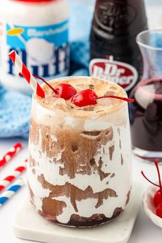 an ice cream sundae with cherries and whipped cream