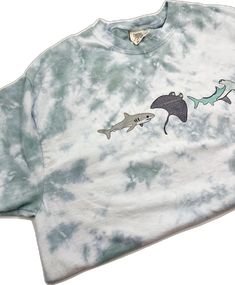 Summer Acid Wash Hand Dyed T-shirt, Summer Tie Dye Soft-washed T-shirt, Tie-dye Crew Neck T-shirt For Beach, Blue Hand Dyed T-shirt For Summer, Hand Dyed Blue T-shirt For Summer, Pre-shrunk Tie-dye Tops For Summer, Tie Dye Tops For Summer, Summer Tie-dye Pre-shrunk Top, Tie Dye Crew Neck T-shirt For Beach