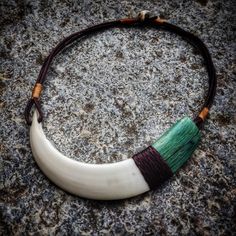 Handmade tribal choker necklace with lower tusk of Maremma wild boar and stabilized wood graft. Leather laces with deer horn toggle closure. Single piece Wolf Fang Necklace, Boar Tooth Necklace, Boar Tusk, Boar Tusk Necklace, Rustic Brown Hand-strung Necklaces, Inuit Necklace, Tusk Necklace, Stabilized Wood, Deer Horn