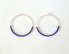 These hoops are 14Kt gold filled and they have dainty and high quality royal blue seed beads.Also available with other types of metals. (choose preference at checkout).❤ SIZESThey measure 45 mm in diameter.❤ PROCESSING AND SHIPPINGMost orders are made and shipped out in one business day. Please check delivery timeframes for your location on the description below.  ❤ CUSTOM ORDERSContact me to discuss you needs!Go back to my shop: https://www.etsy.com/shop/StephanieMartinCoSee more fabulous earri Everyday Blue Hoop Earrings, Blue Wire Wrapped Hoop Earrings As Gift, Blue Small Hoop Earrings With Tiny Beads, Blue Small Hoop Earrings With Wire Wrapping, Blue Wire Wrapped Hoop Earrings For Gift, Blue Dangle Hoop Earrings With Tiny Beads, Blue Beaded Hoop Earrings Gift, Blue Hoop Earrings With Tiny Beads, Blue Wire Wrapped Small Hoop Earrings