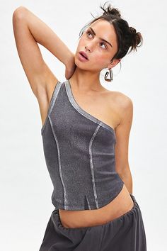 Silence + Noise top elevated in a foiled ribbed knit. Designed in a slim & cropped fit featuring an asymmetric one-shoulder neckline, tailored seams down the bodice and a curved hem. Find it only at Urban Outfitters. Features Silence + Noise Kesha foil ribbed knit one shoulder top Asymmetric tank top Foiled ribbed knit Asymmetric one-shoulder neckline Tailored seams down the bodice & back Curved hem Slim stretch fit Cropped length Easy pull-over style UO exclusive Content + Care 100% Cotton Mach Metallic Fitted Trendy Crop Top, Trendy Fitted Metallic Crop Top, Ribbed Stretch Top For Party, Trendy Fitted One Shoulder Crop Top, Stretch Ribbed Top For Party, Stretch Ribbed Party Top, Stretch One Shoulder Crop Top For Night Out, Chic Fitted Metallic Crop Top, Asymmetrical Stretch Crop Top For Party