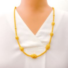 Crafted with exceptional skill, this necklace boasts 22k gold, weighing 36.0 grams, and features a lustrous yellow gold finish. The piece extends 29 inches in length, with an additional 1.75 inches of adjustable links secured by a lobster lock, allowing for a perfect fit. The design showcases a sparkling netted marquise pattern, which combines elegance with intricate detailing, making it a truly stunning accessory. Ideal for those who desire a sophisticated and eye-catching piece of jewelry, this necklace is perfect for special events and occasions, adding a luxurious and radiant touch to any ensemble. PRODUCT DETAILS Gold Purity(karat): 22k Gold Weight(grams): ﻿36.0 Item Finish: Yellow Gold Necklace Length: 29" Adjustable Links: 1.75" Links Lock Style: Lobster Lock Yellow Gold-plated Necklaces With Intricate Design, Gold-plated Yellow Necklaces With Intricate Design, Yellow Gold Plated Necklaces With Intricate Design, Formal Yellow 22k Gold Chain Necklace, Yellow Gold Long Necklace In Temple Jewelry Style, Gold Single Strand Long Necklace As Gift, Gold Single Strand Necklace As A Gift, Yellow Gold Long Temple Jewelry Necklace, Gold Long Temple Necklace With Intricate Design