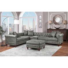 a living room with a sectional couch and ottoman