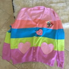 Cakeworthy Stretch Knit Embroidered Sold Out Powerpuff Girls Oversized Cardigan Size 2xl Brand New The Cardigan Of Our Dreams Is Finally Here! Look Like The Most Darling Member Of Townsville In Our Powerpuff Girls Heart Cardigan. Featuring Five Stunning Pastel Stripes, Heart Shaped Pockets, And Blossom, Buttercup, And Bubbles Embroidered On The Front! Even The Buttons Are Heart Shaped- We Can’t Get Enough Of This One! Unisex Fit Heart Pocket 100% Cotton Powerpuff Girls Licensed Product : Cute Crew Neck Cardigan, Multicolor V-neck Cotton Cardigan, Multicolor Cotton V-neck Cardigan, Pink Crew Neck Casual Cardigan, Pink Long Sleeve Cotton Cardigan, Cute Pink V-neck Outerwear, Playful Pink Cotton Sweater, Playful Pink Cardigan For Fall, Cute Multicolor Long Sleeve Cardigan