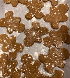 gingerbread cookies with powdered sugar in the shape of flowers