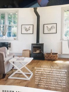 a living room filled with furniture and a fire place in the middle of a room