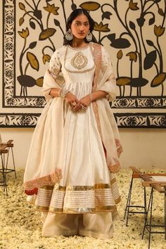 Ivory kalidar anarkali with placement floral, butti embroidery using gota patti, dabka, zardozi work. Paired with a skirt and dupatta with contrast scallop trimmed, embroidered border. - Aza Fashions Rajputi Dress, Skirt Silk, Anarkali Dress Pattern, Designer Blouse Patterns, Indian Bridal Outfits, Indian Dress, Anarkali Dress, Blouse Patterns, Bridal Outfits