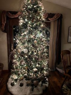 a decorated christmas tree in a living room