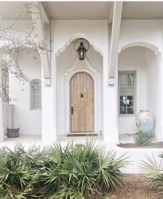 a white house with a wooden front door