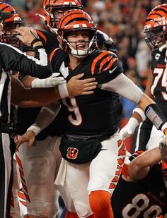 the football players are congratulating each other