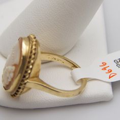 "For sale: (1) d696 Gorgeous 14k Yellow Gold Cameo Ring PLEASE READ ENTIRE DESCRIPTION BEFORE PURCHASING Pre-owned item. Good condition. Please see pictures for details. Sold as is, as seen on pictures. Specifics: 14k Yellow gold Size: 6.75 (U.S.) Width: 23.5 mm Total Weight: 6.7 grams Please be 100% sure of your purchase before buying, as we do not offer refunds. We are more than happy to provide any specific pictures, or answer any questions you have regarding our items. All jewelry is confirm Formal Fine Jewelry Ring With Cabochon, Formal Fine Jewelry Cabochon Ring, Yellow Gold Oval Cabochon Rings For Formal Occasions, Formal Yellow Gold Oval Cabochon Rings, Anniversary Jewelry Ring With Certificate Of Authenticity, Anniversary Ring With Certificate Of Authenticity, Gold Round Cameo Signet Ring, Fine Jewelry Rings With Certificate Of Authenticity As Gift, 14k Gold Jewelry With Certificate Of Authenticity For Anniversary