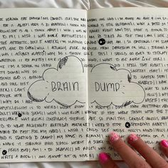 a woman's hand is holding an open notebook with writing on it and the words brain