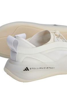 Energize your everyday walking routine in this modern sneaker featuring a speed-lace toggle closure, cushioned BOOST midsole and a durable outsole that gives a spring to every step. Elastic laces with adjustable toggle closure Boost cushioning rebounds quickly from every step, stride or jump Synthetic, recycled synthetic and textile upper/textile lining/rubber sole Imported White Athleisure Running Shoes With Rubber Sole, White Running Shoes With Rubber Sole For Athleisure, White Functional Running Shoes With Abzorb Midsole, White Sneakers With Abzorb Midsole For Running Errands, White Sneakers With Abzorb Midsole For Errands, White Mesh Running Shoes With Abzorb Midsole, Technical White Lace-up Sneakers, White Functional Lace-up Walking Shoes, Functional White Lace-up Walking Shoes