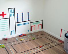 a child's playroom with toys on the floor