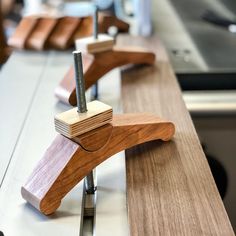 two wooden benches sitting on top of a counter