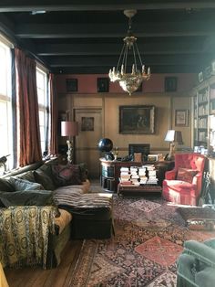 a living room filled with furniture and lots of windows