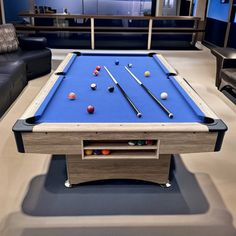 a pool table in the middle of a living room