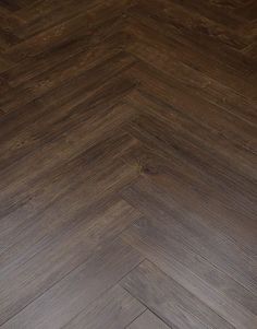 an image of a wood floor that looks like herringbones