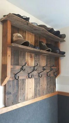 the shoe rack is made out of wood and has shoes hanging on it's hooks