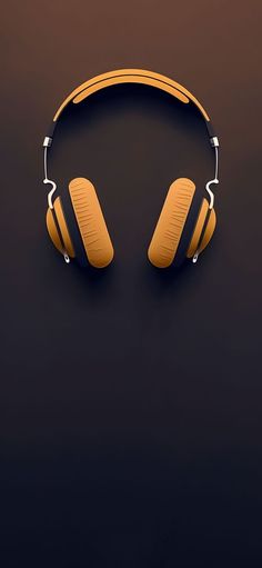 an image of headphones hanging on the wall in front of a dark background,