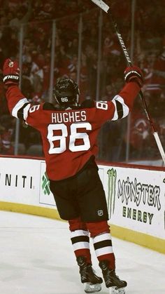 a hockey player celebrating his goal on the ice