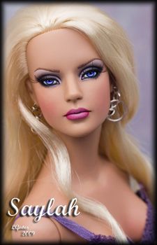 a barbie doll with blonde hair and blue eyes is posed in front of a black frame