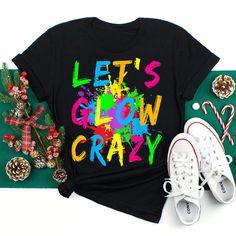 Buy Let’s Glow Crazy Colorful Party Shirt at Fantasywears. Hight quality products with perfect design is available in a spectrum of colors and sizes, and many different types of shirts! Unisex T-Shirt – 100% Cotton (fiber content may vary for different colors) – Medium fabric (5.3 oz/yd² (180 g/m²)) – Classic fit – Tear away the label – Runs true to size Women T-Shirt – 100% combed ringspun cotton (fiber content may vary for different colors) – Light fabric (4.3 oz/yd² (146 g/m²)) – Slim fit with a longer body length – Tear away the label – Runs smaller than [...] 80s Costume Party, Girl Scout Trefoil, Glow Birthday, 80s Costume, Glow Party, Birthday Party Shirt, Neon Party, Matching Tees, T Shirt Costumes