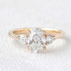 three stone engagement ring setting in rose gold