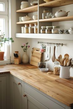 a kitchen counter with wooden utensils and other items on the shelves above it