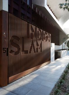 an entrance to a building with wooden slats