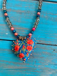 Hand stitched and beaded, this pretty turquoise heart is complimented with a strand of coordinating beads and crystals. the leather straps makes this necklace an adjustable piece. Blue Kimono, Paper Lace, Instagram Help, Turquoise Heart, Hand Stitched, Accessories Shop, Hand Stitching, Heart Pendant, Leather Straps